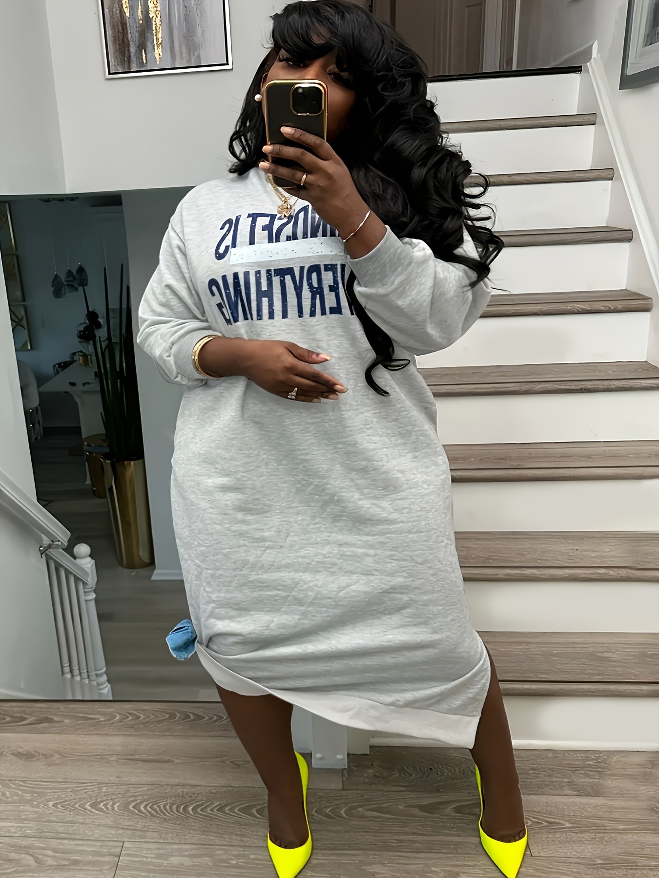Plus-Size Casual Dress for Women, Featuring a Stylish Printed Color-Blocked Design with a Slit, Resembling a Sweatshirt Dress.
